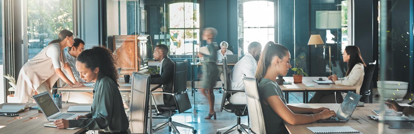 A team working at desks in a bright open office
